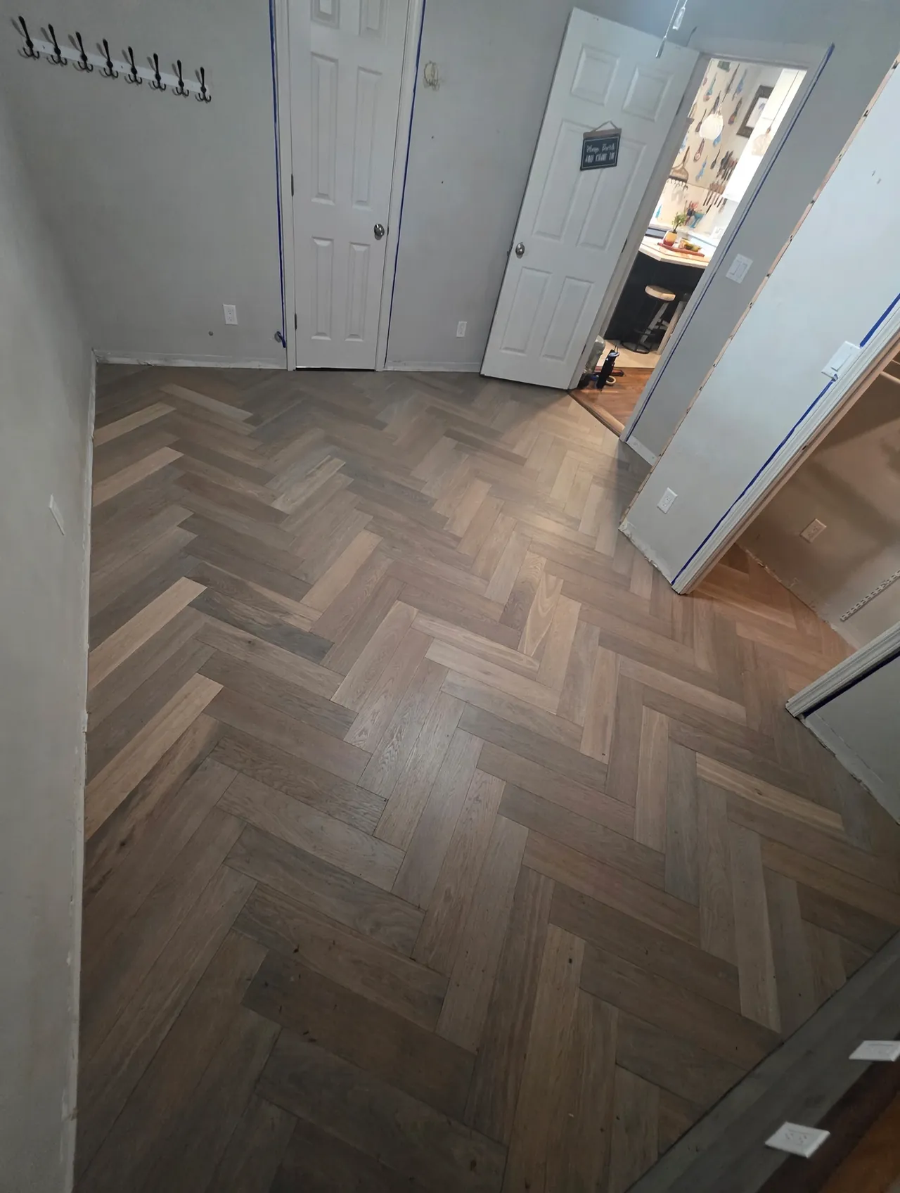 Completed herringbone wood-look floor installation