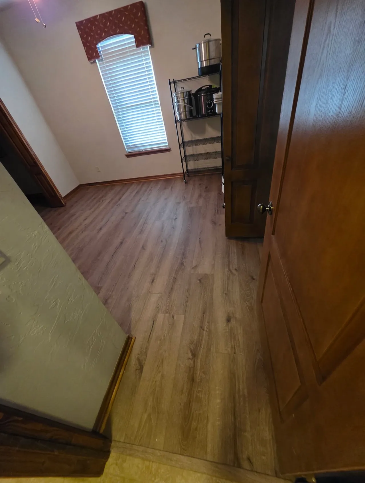 Finished luxury vinyl plank flooring in a bedroom