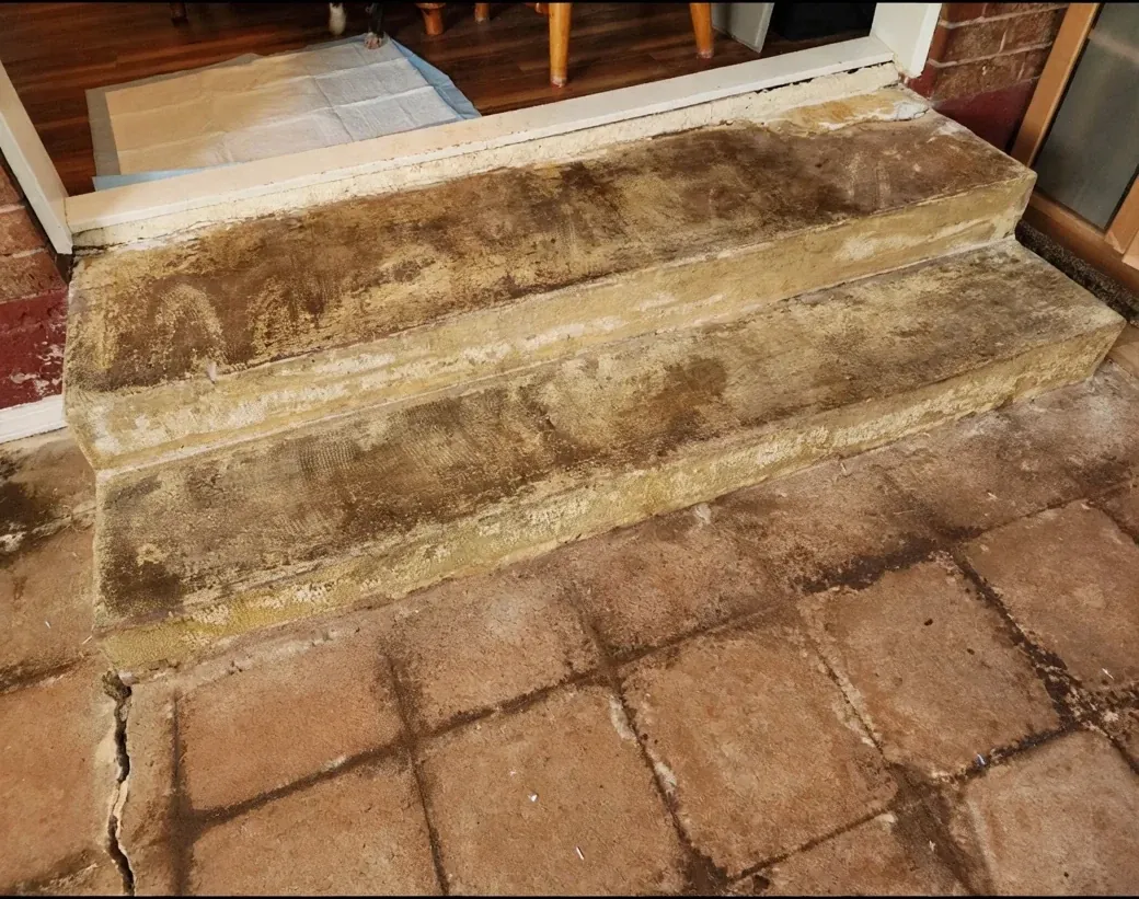 Concrete staircase before luxury vinyl plank installation